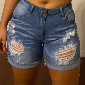 Distressed blue jean shorts from fashion nova